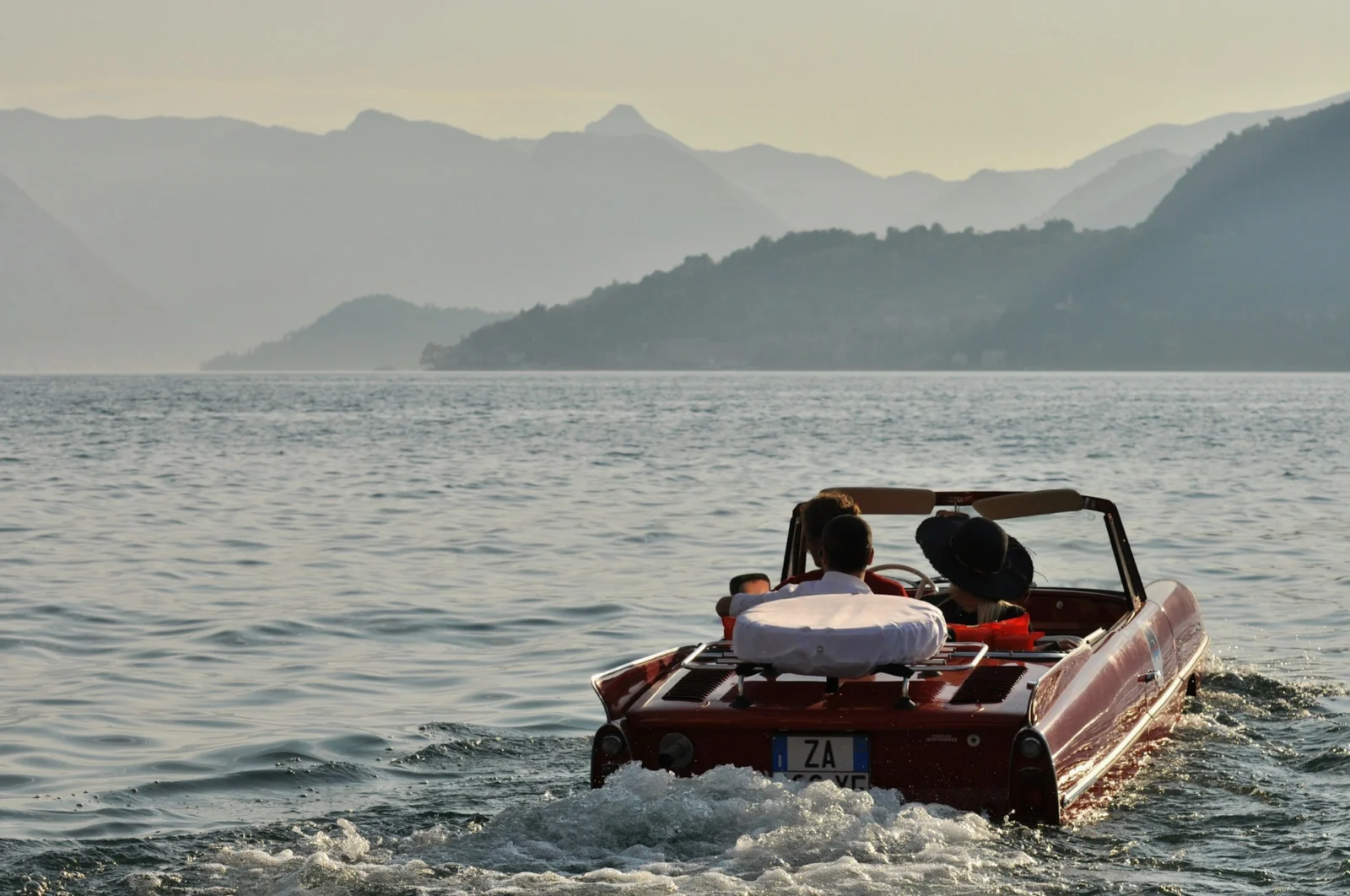 Classic Riva-style boat cruising on Lake Como